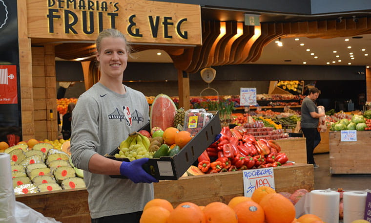 Essentials Express man with fruit and vegetables